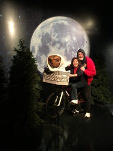 My wife, Nancy, and I ride the E.T. bike at Madame Tussauds wax museum in New York.
